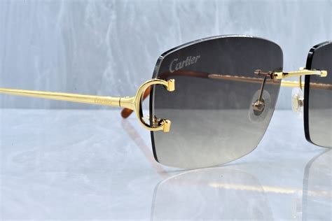 rimless big c cartier glasses.